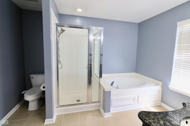 full bathroom with toilet, a shower stall, tile patterned flooring, and a garden tub