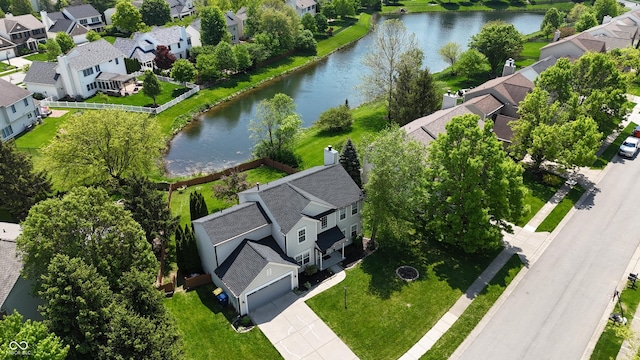 aerial view of residential area with a large body of water