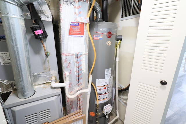 utility room featuring gas water heater