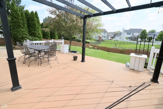 view of patio / terrace featuring a wooden deck, a pergola, outdoor dining space, and a residential view