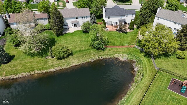 aerial view of residential area featuring a nearby body of water