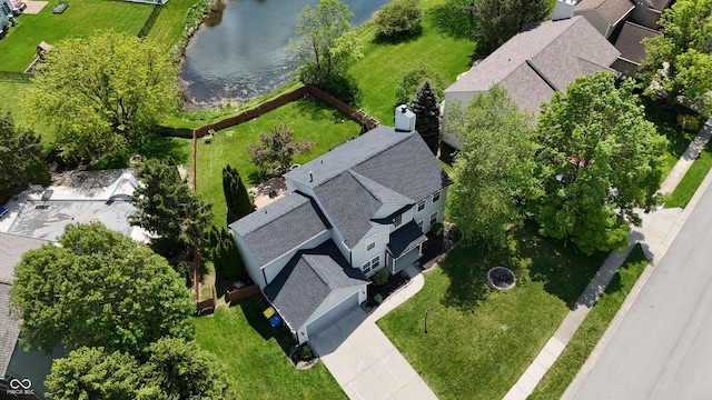 aerial view of residential area with a large body of water