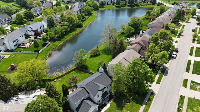 aerial view of residential area with a large body of water
