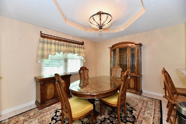 10713 Stable Dr, Indianapolis, IN 46239 - dining space featuring light tile patterned flooring, a chandelier, and baseboards