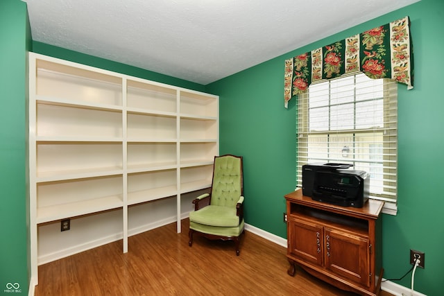 10713 Stable Dr, Indianapolis, IN 46239 - living area featuring wood finished floors, a textured ceiling, and baseboards
