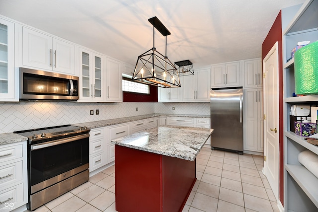 10713 Stable Dr, Indianapolis, IN 46239 - kitchen featuring stainless steel appliances, a chandelier, decorative backsplash, and light tile patterned floors
