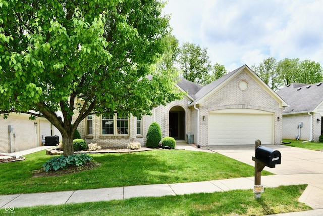 10713 Stable Dr, Indianapolis, IN 46239 - view of front of property with a garage, driveway, brick siding, and a front yard