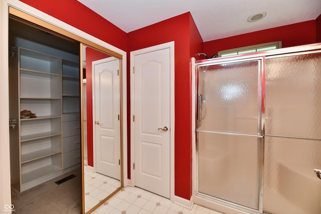 10713 Stable Dr, Indianapolis, IN 46239 - full bath with a closet, a shower stall, and tile patterned floors