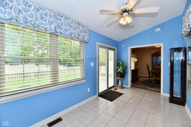 10713 Stable Dr, Indianapolis, IN 46239 - entryway featuring lofted ceiling, baseboards, ceiling fan, and light tile patterned floors