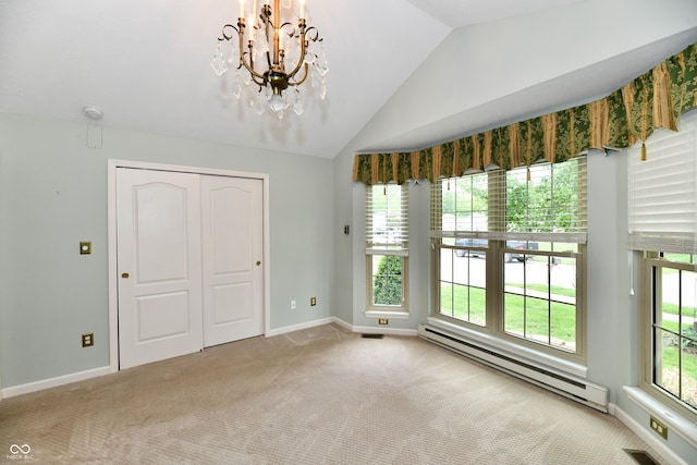 10713 Stable Dr, Indianapolis, IN 46239 - carpeted empty room featuring a baseboard radiator, a chandelier, vaulted ceiling, and baseboards