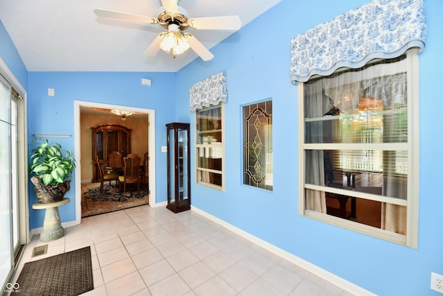 10713 Stable Dr, Indianapolis, IN 46239 - corridor with tile patterned flooring, vaulted ceiling, and baseboards