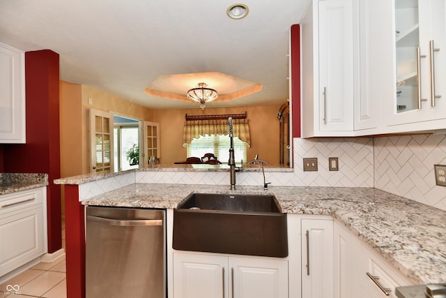 10713 Stable Dr, Indianapolis, IN 46239 - kitchen featuring dishwasher, a sink, decorative backsplash, white cabinetry, and light stone counters