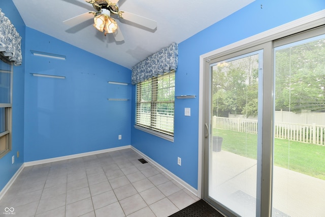 10713 Stable Dr, Indianapolis, IN 46239 - doorway with vaulted ceiling, a ceiling fan, light tile patterned flooring, and baseboards