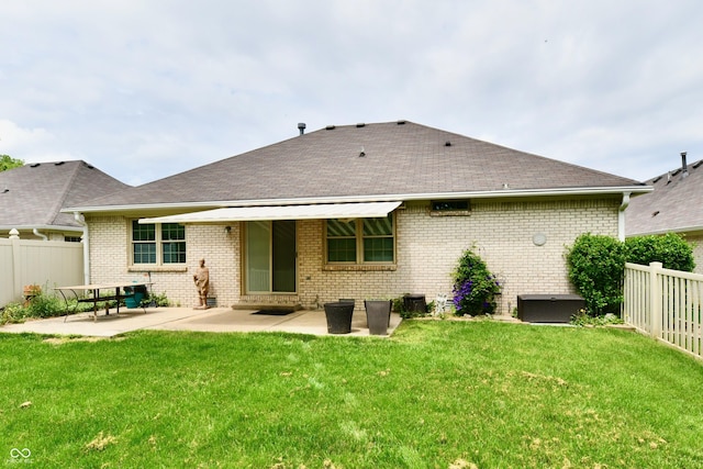 10713 Stable Dr, Indianapolis, IN 46239 - back of house featuring a patio, brick siding, and a shingled roof