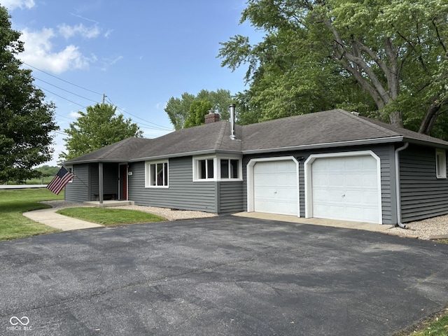 7897 Moore Rd, Indianapolis, IN 46278 - ranch-style house with a chimney, an attached garage, driveway, and a shingled roof