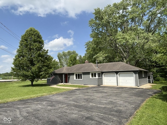 7897 Moore Rd, Indianapolis, IN 46278 - single story home featuring driveway, an attached garage, and a front yard