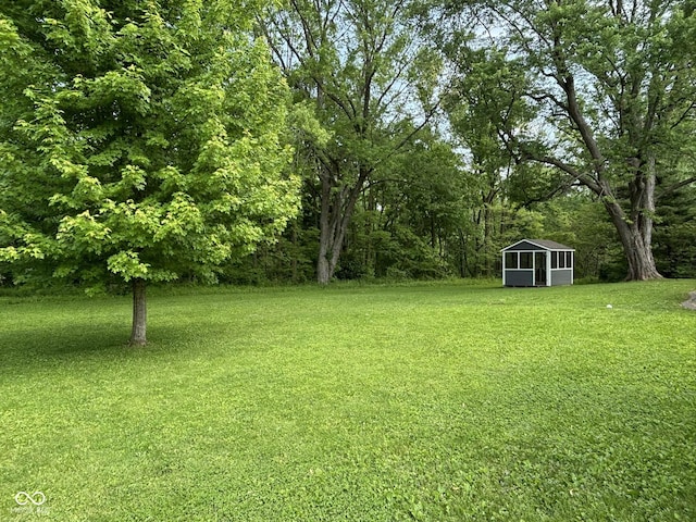 7897 Moore Rd, Indianapolis, IN 46278 - view of grassy yard featuring an outbuilding