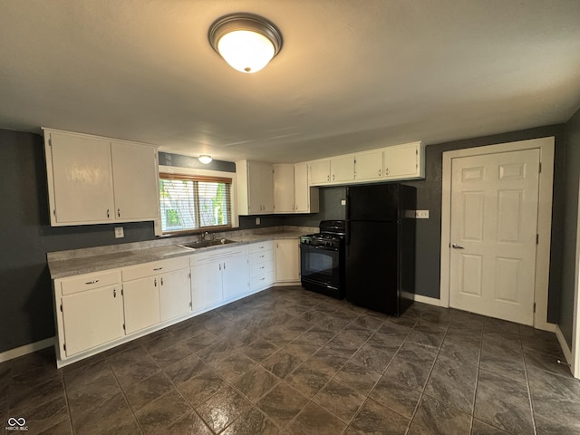 7897 Moore Rd, Indianapolis, IN 46278 - kitchen with black appliances, a sink, white cabinets, and baseboards