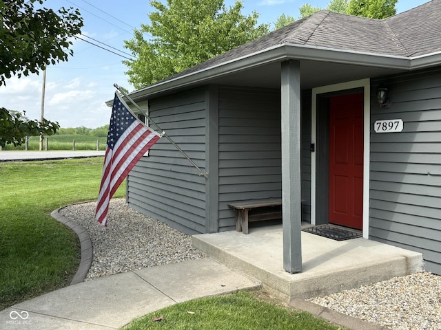 7897 Moore Rd, Indianapolis, IN 46278 - entrance to property featuring a yard and a shingled roof
