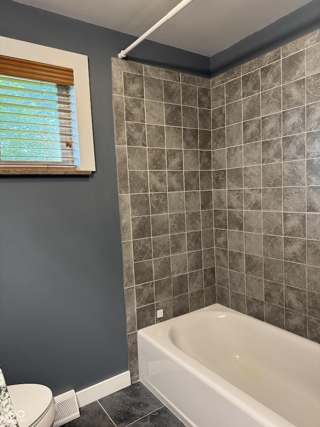 7897 Moore Rd, Indianapolis, IN 46278 - bathroom featuring tile patterned flooring, baseboards, toilet, and shower / tub combination