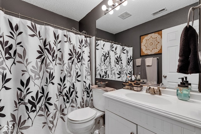 full bathroom with a textured ceiling, vanity, toilet, and a shower with shower curtain
