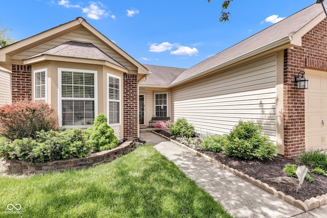 view of front of property featuring brick siding and an attached garage