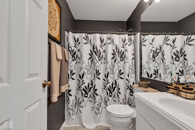 full bath with a textured ceiling, vanity, toilet, and a shower with shower curtain