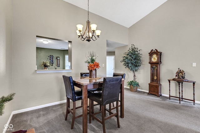 carpeted dining area with high vaulted ceiling, baseboards, and a chandelier