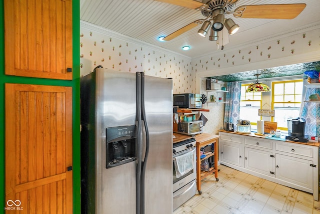 kitchen with a ceiling fan, wallpapered walls, stainless steel appliances, crown molding, and light floors