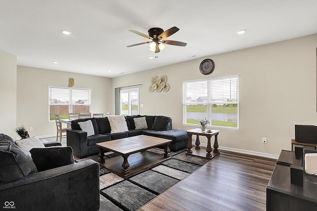 living room featuring recessed lighting, baseboards, a ceiling fan, and dark wood-style floors