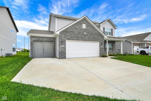 traditional-style home with an attached garage, concrete driveway, brick siding, and a front yard