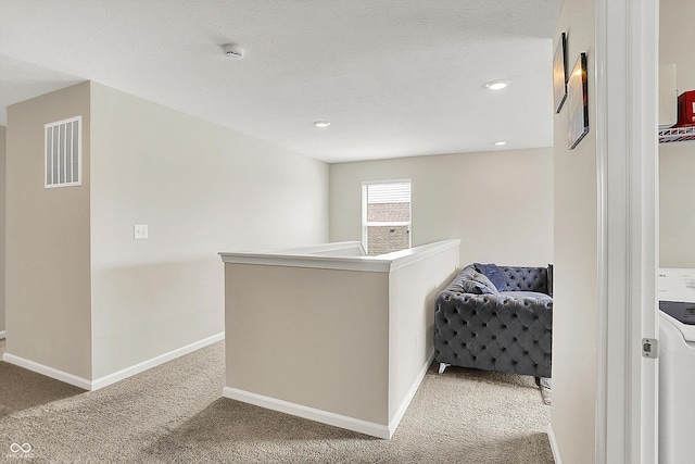 hall with baseboards, recessed lighting, visible vents, and light colored carpet