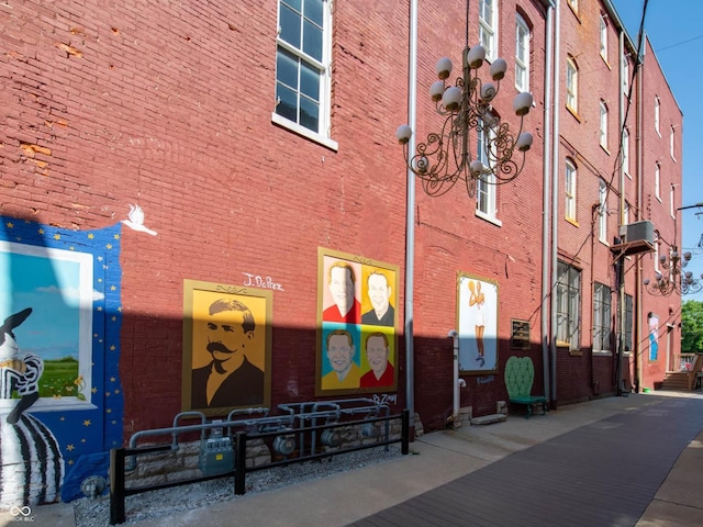 view of building exterior with central AC unit