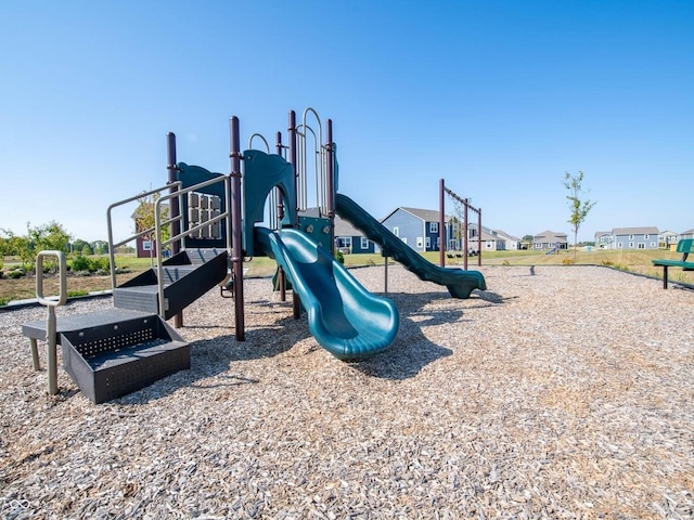 communal playground featuring a residential view