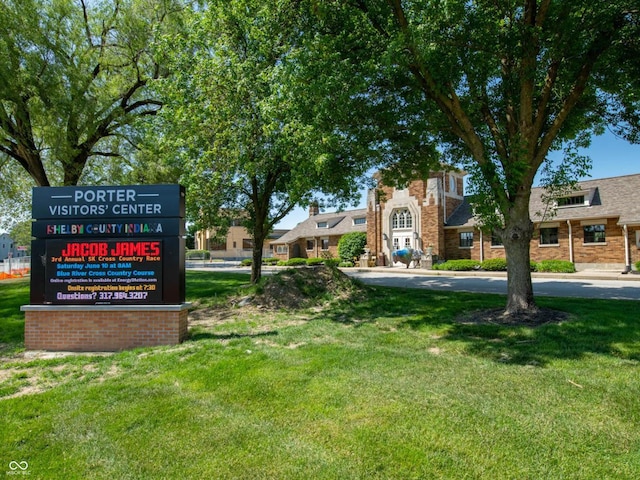 view of property's community with a yard