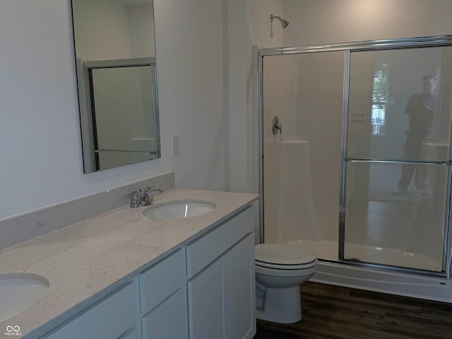 1400 Bluebonnet Pl, Shelbyville, IN 46176 - bathroom with a stall shower, double vanity, and wood finished floors