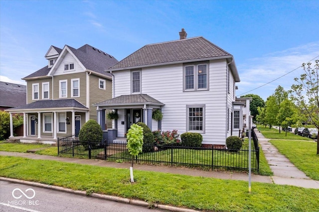 925 S State Ave, Indianapolis, IN 46203 - view of front of home featuring a porch and a chimney