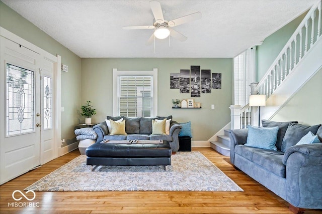 925 S State Ave, Indianapolis, IN 46203 - living area featuring plenty of natural light, stairs, wood finished floors, and a textured ceiling