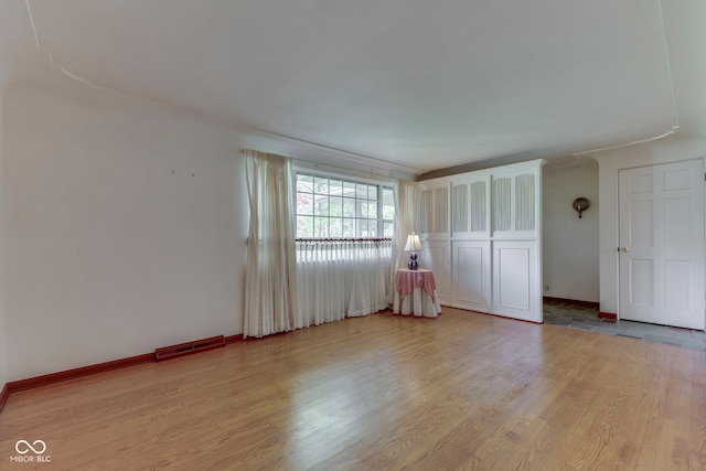 8903 Maple Hill Dr, Indianapolis, IN 46239 - unfurnished bedroom featuring light wood-style flooring and baseboards
