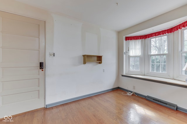 8903 Maple Hill Dr, Indianapolis, IN 46239 - spare room with light wood-style flooring and baseboards