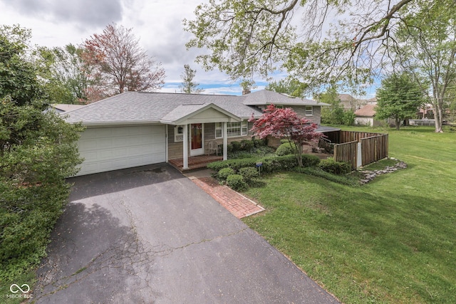 8903 Maple Hill Dr, Indianapolis, IN 46239 - single story home with driveway, a garage, and a front yard