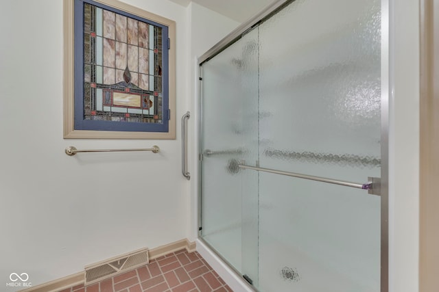 8903 Maple Hill Dr, Indianapolis, IN 46239 - bathroom with baseboards, a stall shower, and brick patterned floors
