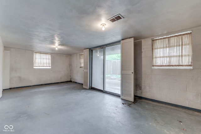 8903 Maple Hill Dr, Indianapolis, IN 46239 - empty room with concrete floors and concrete block wall