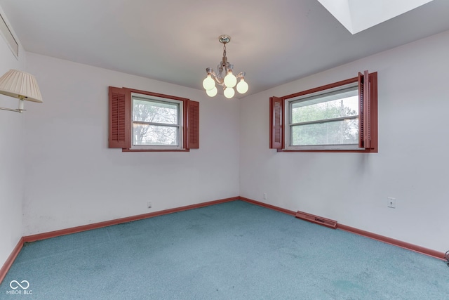 8903 Maple Hill Dr, Indianapolis, IN 46239 - carpeted spare room with plenty of natural light, a chandelier, baseboards, and a skylight