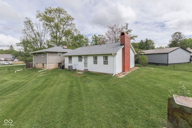 8903 Maple Hill Dr, Indianapolis, IN 46239 - back of property with a chimney, entry steps, and central AC