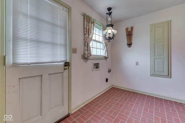 8903 Maple Hill Dr, Indianapolis, IN 46239 - unfurnished dining area with brick patterned floors and baseboards
