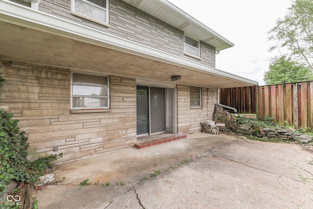 8903 Maple Hill Dr, Indianapolis, IN 46239 - rear view of house featuring fence and a patio