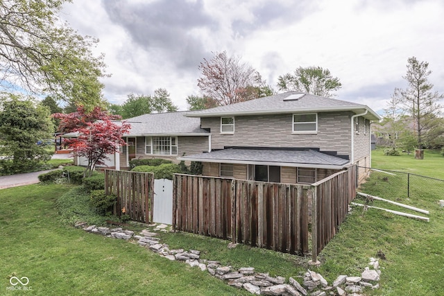 8903 Maple Hill Dr, Indianapolis, IN 46239 - rear view of property featuring a shingled roof