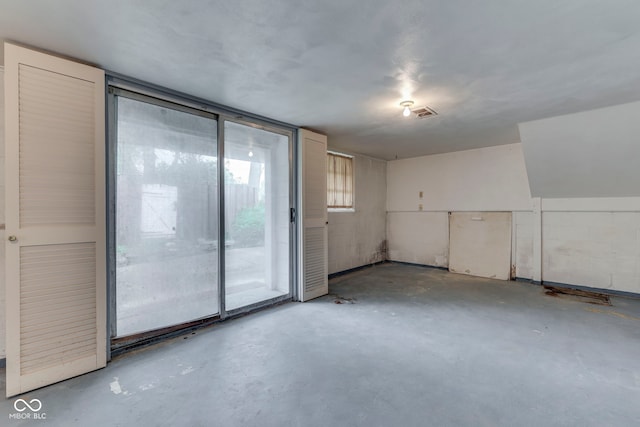 8903 Maple Hill Dr, Indianapolis, IN 46239 - empty room featuring unfinished concrete flooring