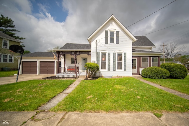 view of front of home featuring covered porch, a garage, driveway, a front yard, and roof with shingles